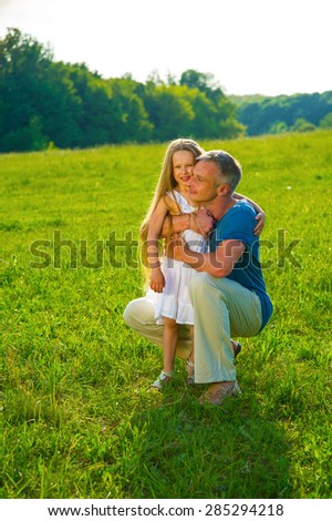 Dad hugging daughter. Family happiness.
