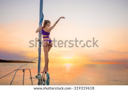 Recreation on the islands. Walk on the yacht near the islands. Romantic holiday on the water. Girl on a yacht on sunset background.