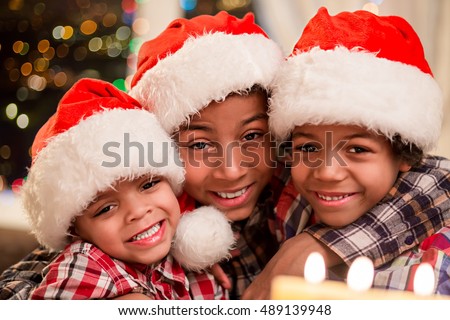 stock-photo-three-kids-in-christmas-hats