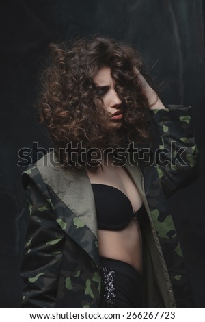 fatal error young girl soldier in the army. sexy woman in camouflage, her face is covered by hair