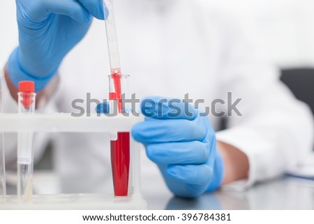 Professional young scientist is testing samples