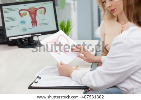 Beautiful blond girl is consulting a doctor