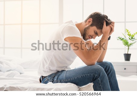 Young guy suffering from headache