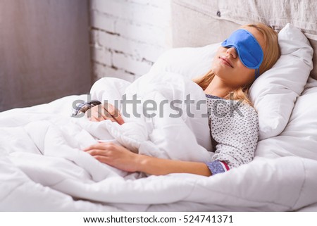 Calm young woman sleeping at home