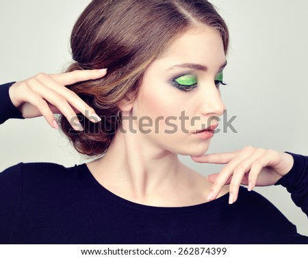 girl with beautiful hair and bright makeup in the evening wear