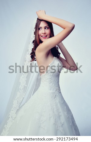 Beauty woman with wedding hairstyle and makeup. Bride fashion. Woman in white dress.