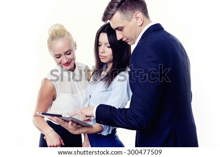 Image of business partners discussing documents and ideas at meeting. Work process of business meeting with electronic devices in office.