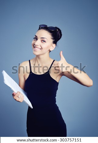 businesswoman holding papers in hands