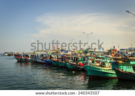 PhuQuoc, Vietnam - November 2nd, 2013: At sunset, trip to AnThoi fishing port. fishisng boats in queue. At AnThoi port, PhuQuoc, Vietnam