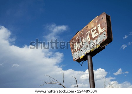 Rusty old motel sign with bullet holes and good grunge.
