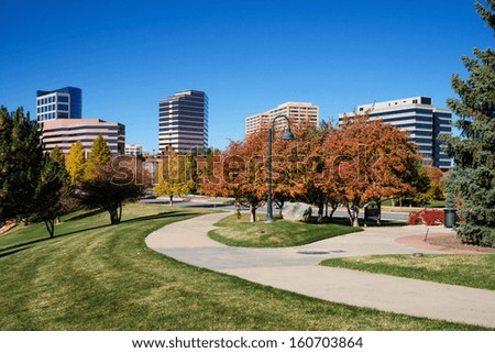 The Denver Tech Center skyline, or DTC, in Autumn with beautiful trees and walking path.