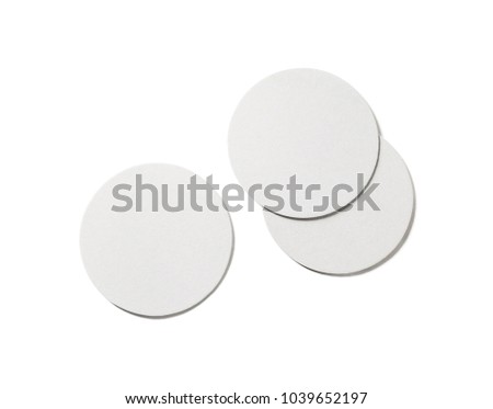Photo of blank beer coasters on white background. Isolated with clipping path. Flat lay.