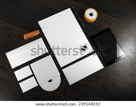 Corporate stationery on wooden background. Top view.