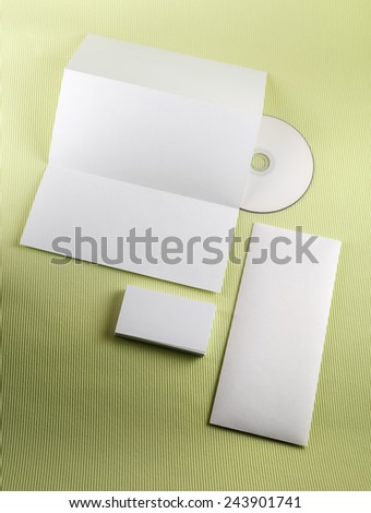 Template for branding identity on green background. Blank corporate identity set. Vertical shot.