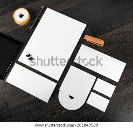 Corporate stationery on wooden background. For design presentations and portfolios. Top view.