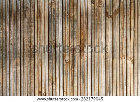 Old wood plank texture. Weathered wooden background with knots.
