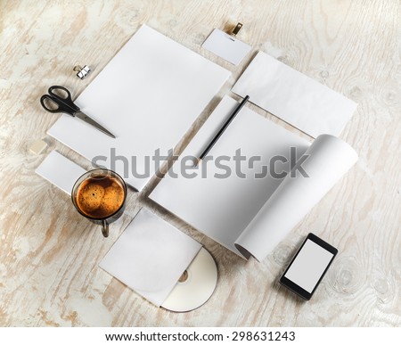 Corporate identity template on light wooden background. For design presentations and portfolios. Top view.
