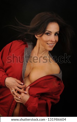 Hispanic woman with clothing partially off.Hot Hispanic Woman.Studio photograph of a young latin woman with clothing partially off