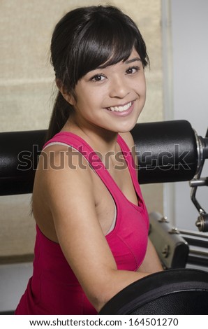 Young Asian woman with gym equipment/Woman Health and Fitness/Young attractive female with various types of exercise equipment