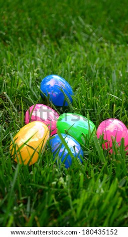 Solid color eggs on grass/Easter Egg Time/Multicolor eggs are lying on grass