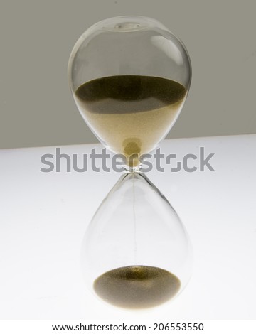 Sand Streams in a hour glass/Hour Glass/Vintage hand blown hour glass with sand streaming marking time