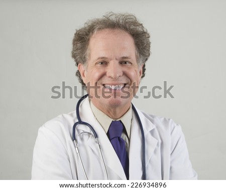 Expressive senior medical doctor/Senior Medical Doctor/Senior medical doctor dressed in white lab coat