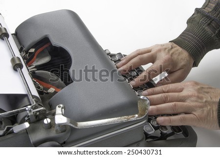 Hands on typewriter/Antique Typist/Man using a vintage typewriter