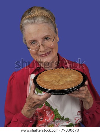 Grandmother with pie/Grandmother and Love/Senior woman or grandmother offering a pie