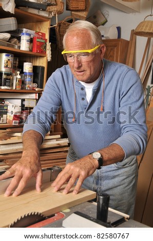 Senior Man at Workshop/Working with Wood/Senior man in his workshop with his tools