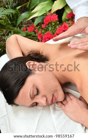 Woman on massage table/Woman Experience Healing/ Woman outdoors on a massage table