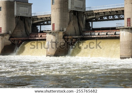 water discharge at the river dam in the spring flood