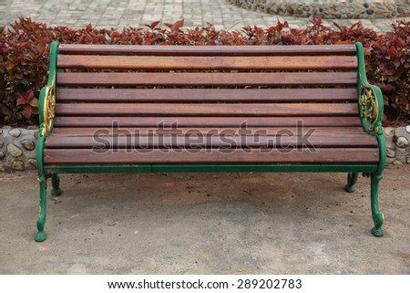 Wooden bench on concrete floor
