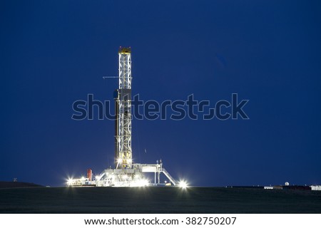 A well drilling rig works in the eastern plains of Colorado.  Once drilled, water, sand and chemicals will be injected under high pressure to fracture the shale, releasing oil and gas.