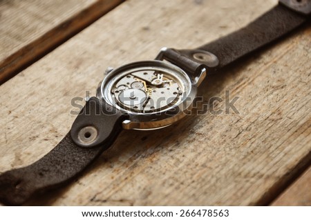 Old watches on a wooden window sill