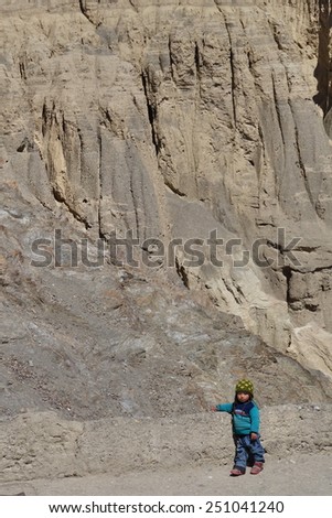 20 April 2014 : Little boy on the street of Moonland, Ladakh. This area is strange but beautiful landscape next to Lamayuru Monastery. Some say the soil here is very similar to that on the moon.