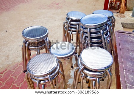 Closeup stack of metal chairs