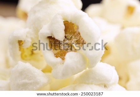 Extremes close-up image of sweet popcorn/ Close-up of sweet popcorn / Extremes close-up image of sweet popcorn. Focus Center  (corn, pop corn, snack)