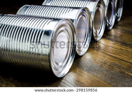 Tin can for food on wooden background