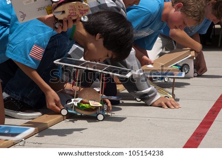 SAN DIEGO-JUNE 9:Unidentified students at the starting line of the Junior Solar Sprint in San Diego, CA on June 9, 2012. The student solar technology & engineering event was held annually.
