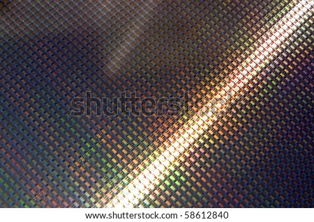 Close up of a silicon wafer of SIM computer chips.