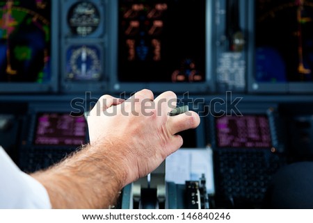 Pilot Pulling an Aircraft Throttle