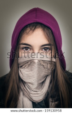 Serious Teenager with Her Mouth Covered