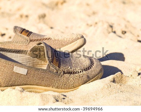 Oldr shoes in the sand