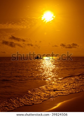 stock photo : Fish boat at sunset in a beach of Fuerteventura stock photo : Fish boat at sunset in a beach of Fuerteventura