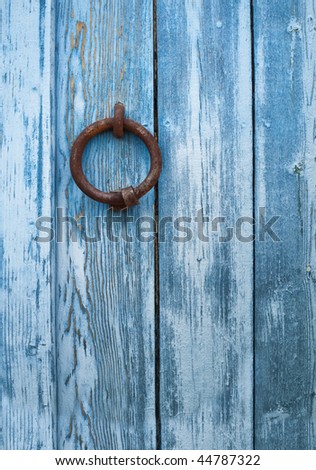 Antique Doorknocker of a typical tunisia rusty door