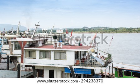 CHIANG RAI, THAILAND - JULY 5,2015 - Golden triangle in Thailand .The Golden Triangle designates the confluence of the Ruak River and the Mekong River,transportation chinese ship parking on the dock