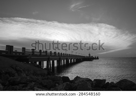 black and white jetty on the sea