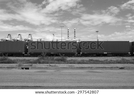 Black and white cargo train platform with container