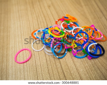 color rubber hair bundle on the wooden background