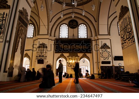 BURSA, TURKEY - March 9 : ULUCAMI is famous Mosque in BURSA Town. on 09.03.2014 in Bursa,Turkey.  People are pray inside the mosque. Ulucami built in between 1397 - 1400.